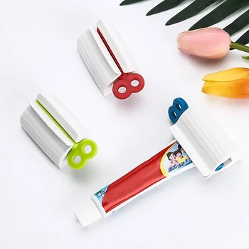 Паста за зъби за изстискване на Домакински паста за зъби Устройството за изстискване тюбиков мързелив паста за зъби Прес-аксесоари за баня Случаен цвят